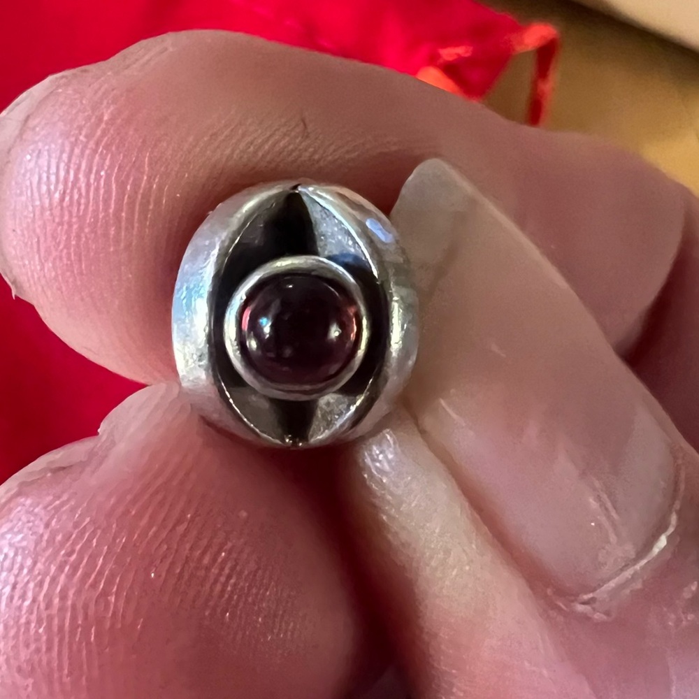 Sterling silver Pandora real garnet eye retired charm